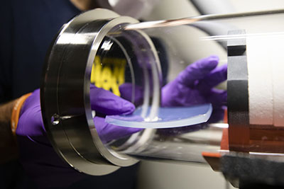 A solar-transparent, heat-trapping aerogel is placed into a test rig to demonstrate its use in solar-thermal power plants. Photo: Evan Dougherty/Michigan Engineering