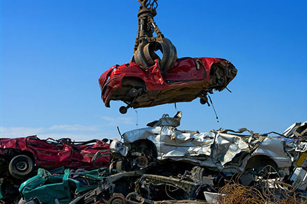 Car at a junkyard. Photo: Adobe
