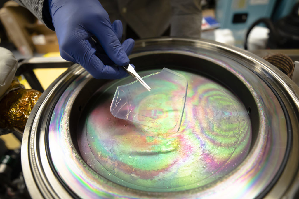 >A solar-transparent aerogel is placed into a device that will apply an atom-thick coating for use in solar-thermal power plants. Photo: Evan Dougherty/Michigan Engineering