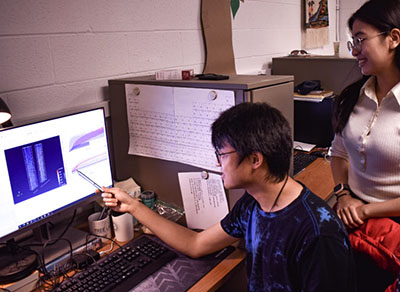 Dr. Bala Chandran’s students, Bingjia Li and Zijie Chen, working on models of flowing particles.