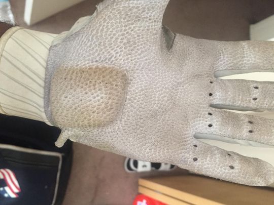 A glove worn by Michigan second baseman featured extra padding to provide protection after hand surgery
