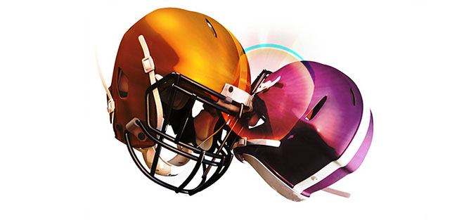 Two football helmets collide. Michigan Engineering researchers are developing an advanced helmet system that actually dissipates energy to better protect the brain. That's something today's helmets don't do. Credit: Stephen Alvey