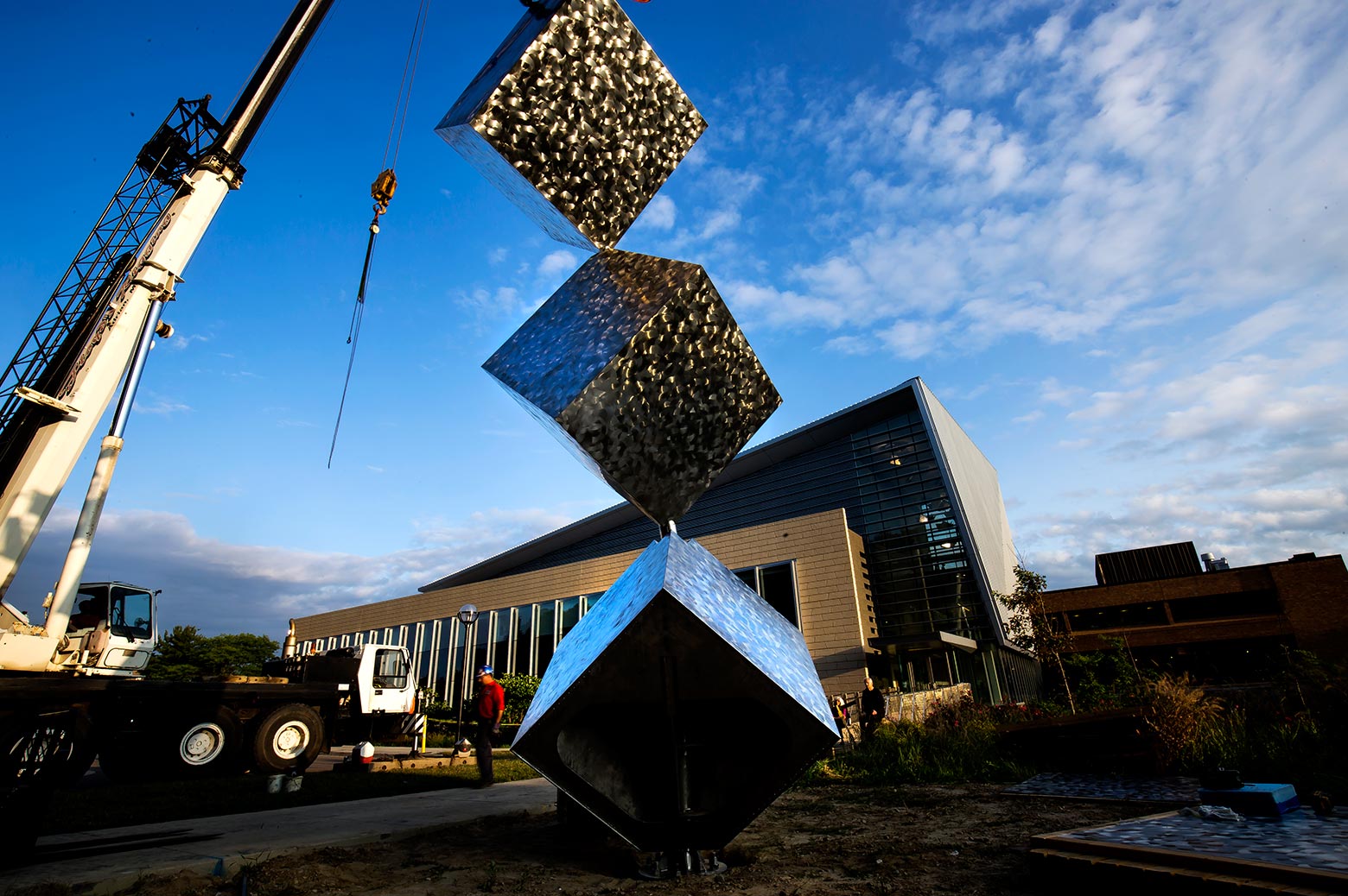 The sculpture is a 14,000 pound, 25-foot tall kinetic structure that took Philip Stewart, Pinwheel artist, two years to design.
