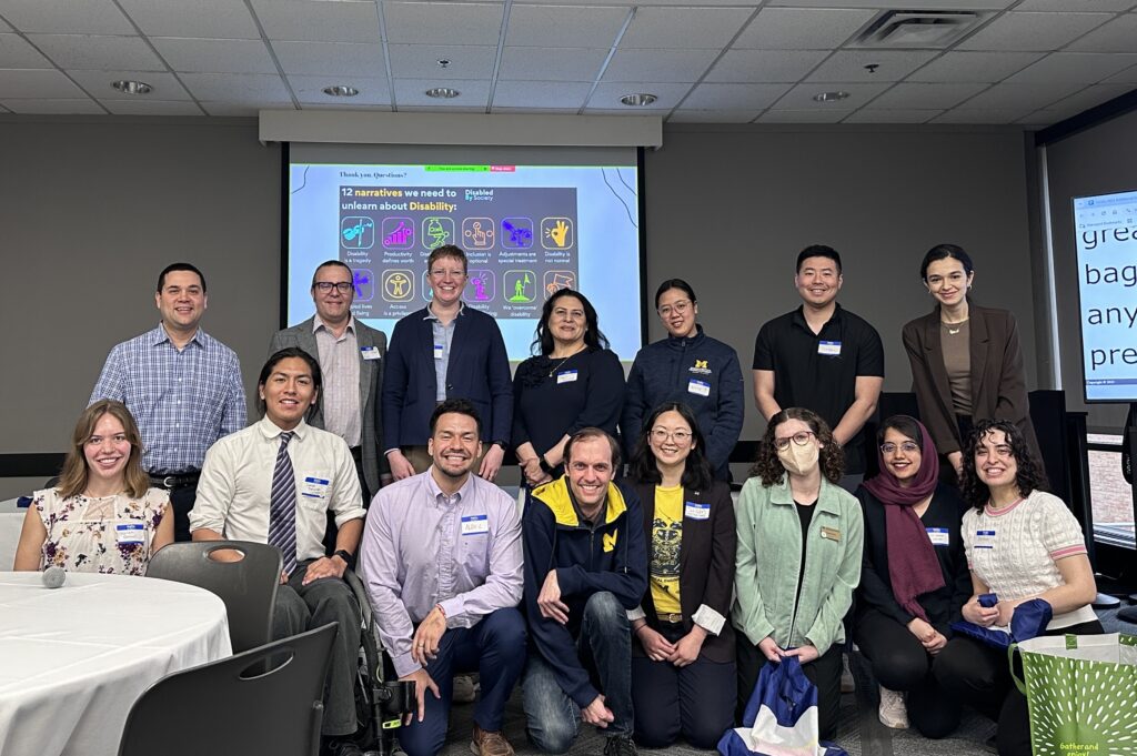 A subset of speakers, planning team members, and volunteers for the 2025 Disability Visibility in Engineering Symposium gathers for a photo.