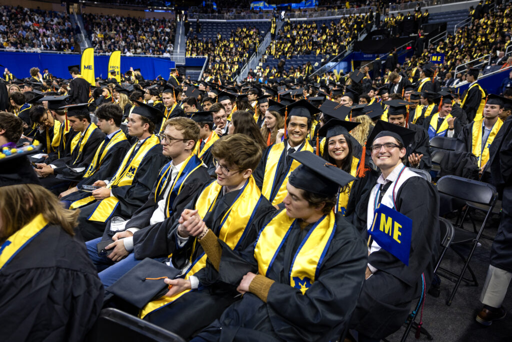 Students gather in graduation caps and gowns for the University of Michigan College of Engineering 2025 Undergraduate Commencement Ceremony at Chrysler Center in Ann Arbor.
